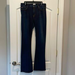 Hudson Mia mid-rise flare dark wash jeans with slight feathering at pockets.